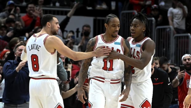February 24, 2022; Chicago Bulls forward DeMar DeRozan celebrates with Zach LaVine Ayo Dosunmu during the game vs. Atlanta Hawks